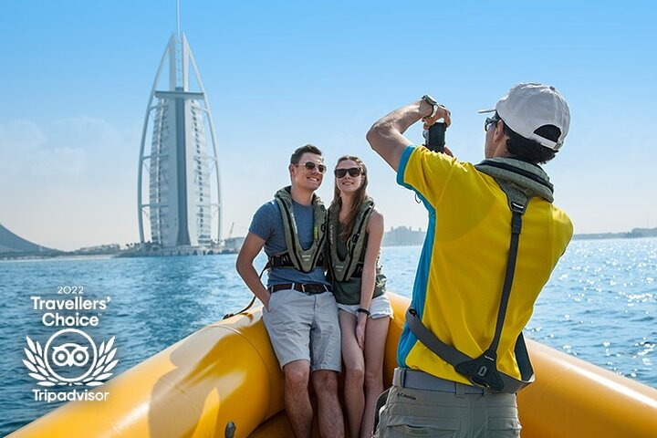 Experience breathtaking views as you cruise past iconic landmarks like Burj Al Arab and Atlantis capturing unforgettable moments amidst Dubai's stunning coastline and modern architecture.